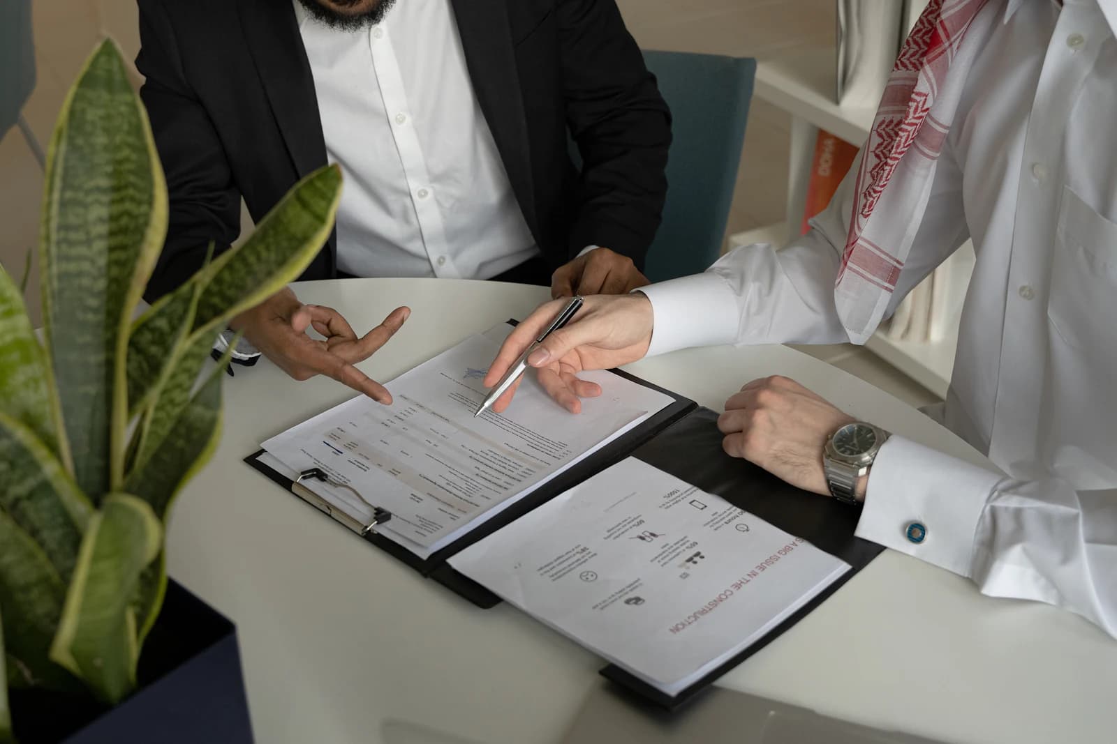 Two colleagues reviewing a document together
