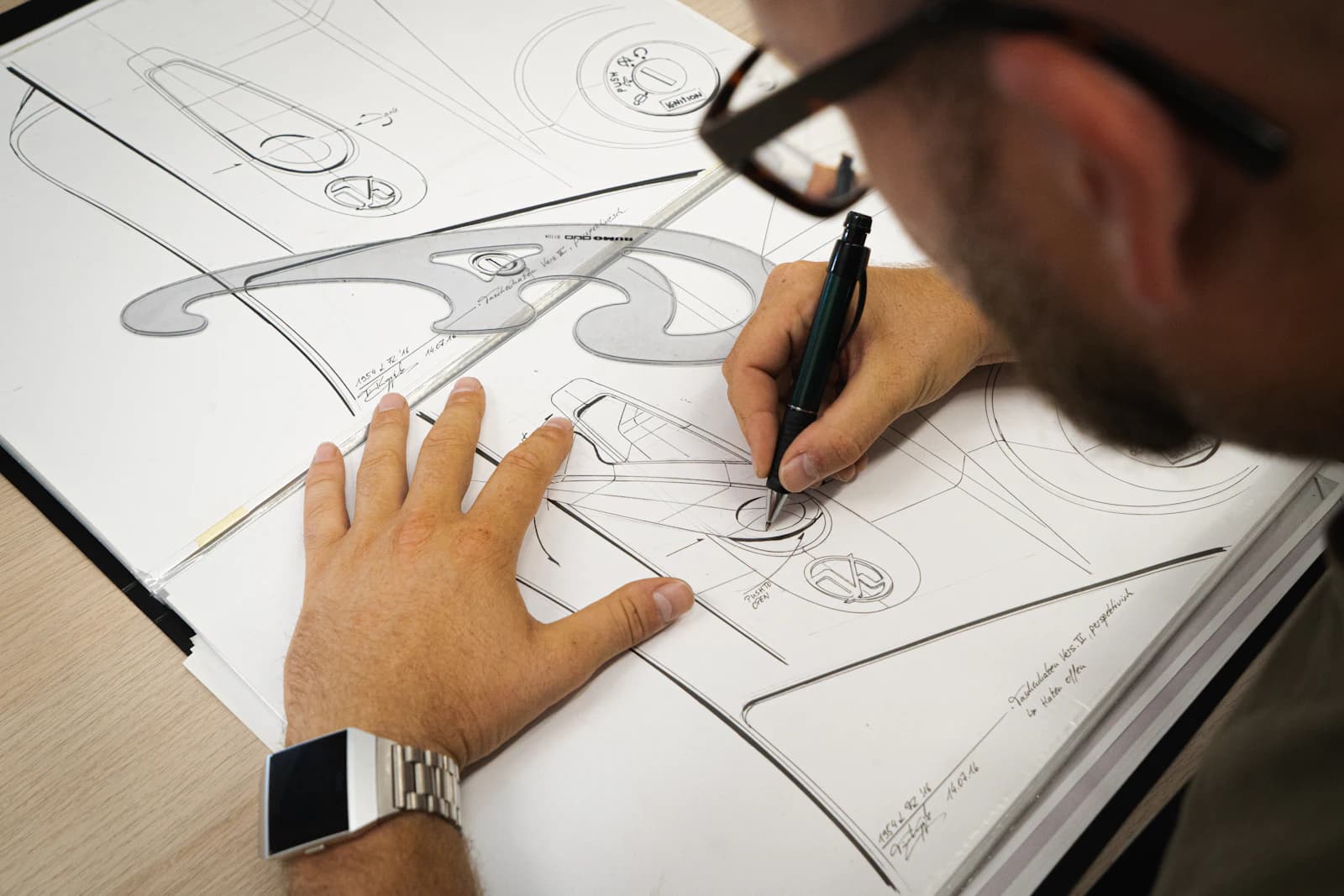 A designer sketching ideas on paper