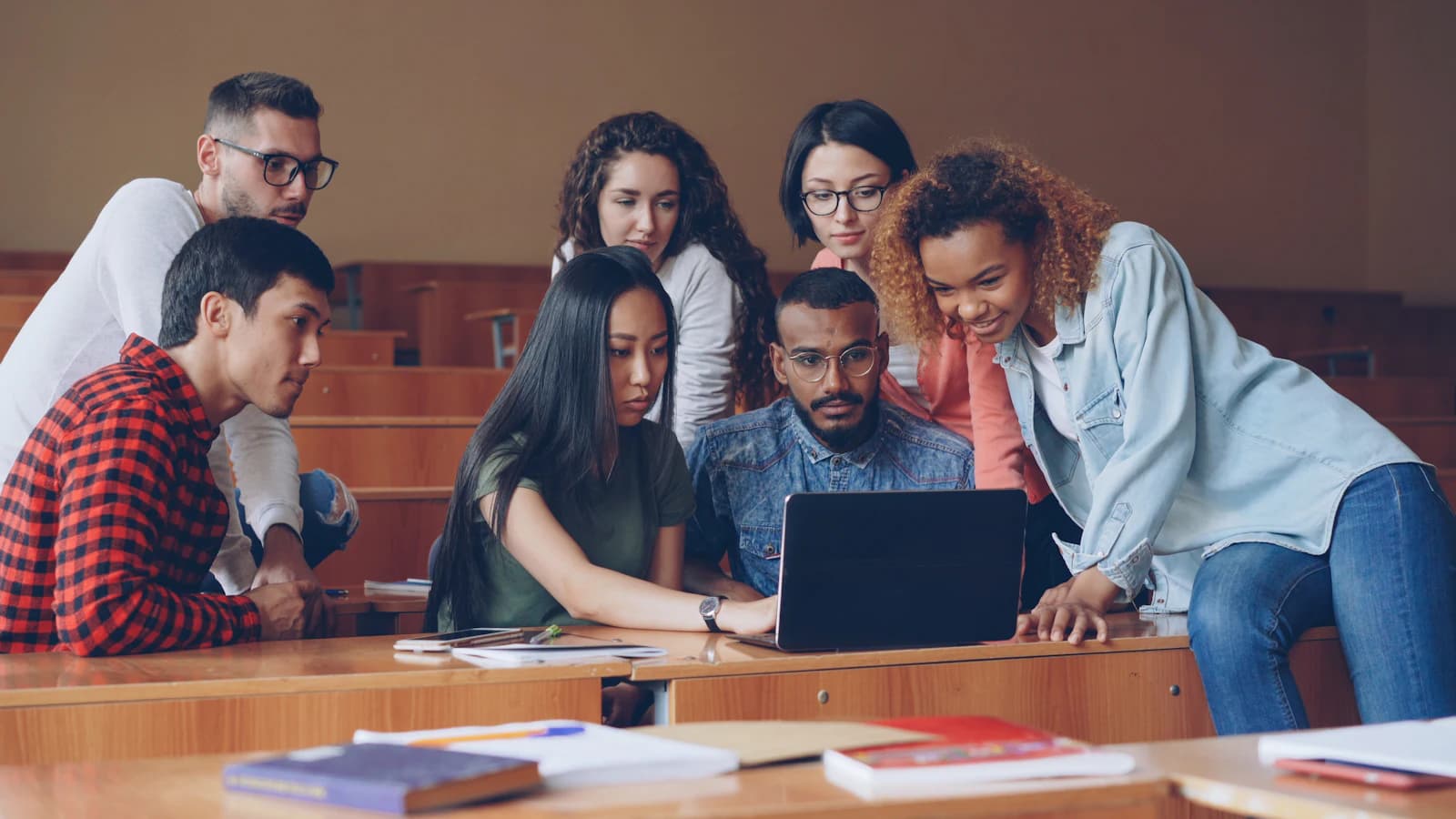 A group learning together around a laptop