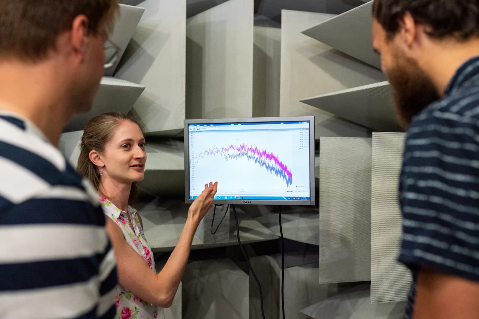 A team reviewing a chart on a screen together