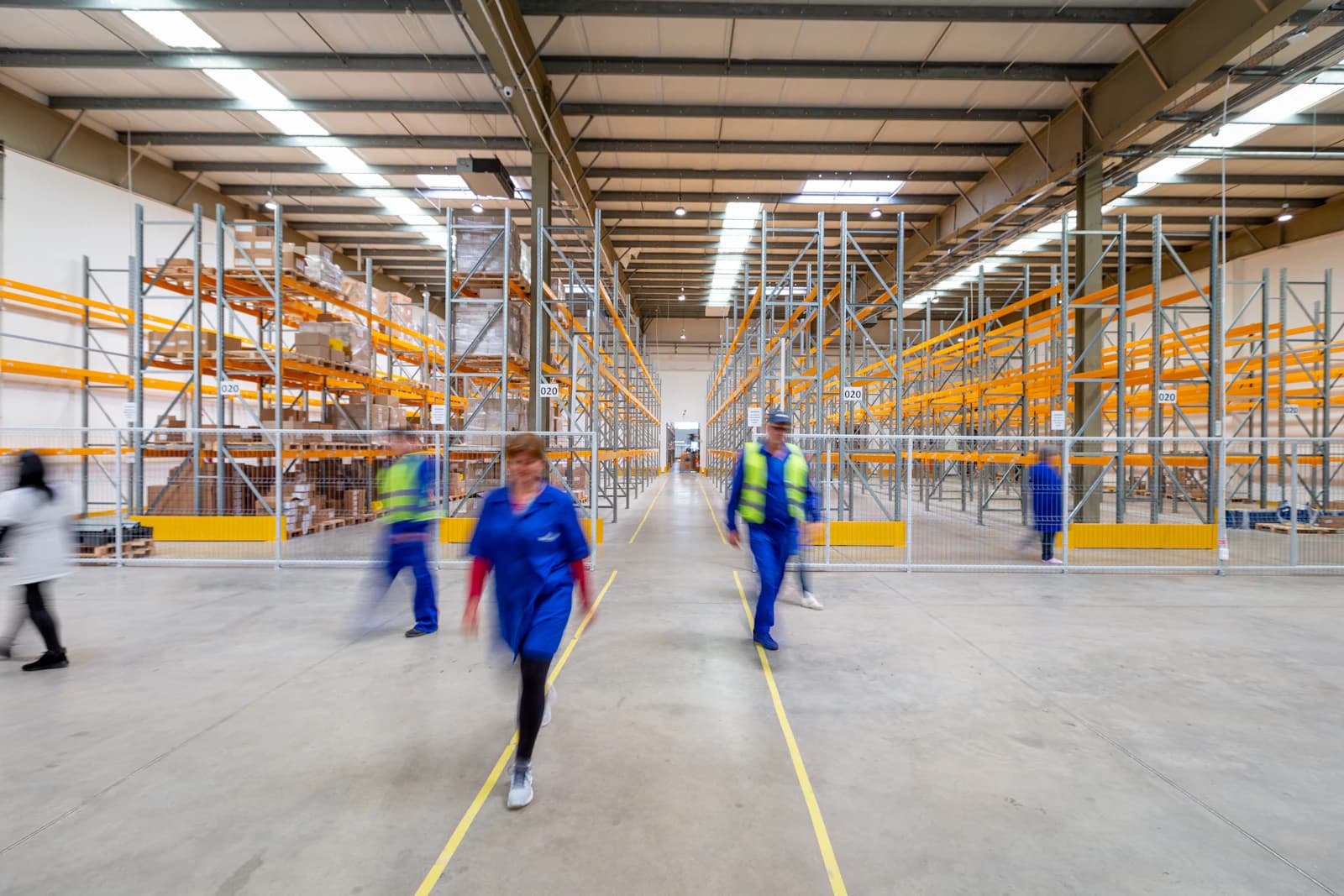 Staff walking through a large distribution centre